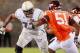 BLACKSBURG, VA - SEPTEMBER 03: Guard Omoregie Uzzi #77 of the Georgia Tech Yellow Jackets blocks against the Virginia Tech Hokies at Lane Stadium on September 3, 2012 in Blacksburg, Virginia. (Photo by Geoff Burke/Getty Images)
