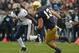 SOUTH BEND, IN - NOVEMBER 03: Ray Graham #1 of the Pittsburgh Panthers runs as Danny Spond #13 of the Notre Dame Fighting Irish closes in at Notre Dame Stadium on November 3, 2012 in South Bend, Indiana. Notre Dame defeated Pittsburgh 29-26 in triple overtime. (Photo by Jonathan Daniel/Getty Images)