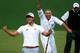 Adam Scott and his caddy Steve Williams celebrate while Angel Cabrera looks on