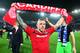 CARDIFF, WALES - APRIL 16: Craig Bellamy of Cardiff City celebrates his team's promotion to the Premier League at the end of the npower Championship match between Cardiff City and Charlton Athletic at the Cardiff City Stadium on April 16, 2013 in Cardiff, Wales. (Photo by Michael Steele/Getty Images)