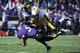 EVANSTON, IL - OCTOBER 27: Venric Mark #5 of the Northwestern Wildcats is tackled by Micah Hyde #18 of the Iowa Hawkeyes on October 27, 2012 at Ryan Field in Evanston, Illinois. (Photo by David Banks/Getty Images)