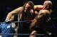 SYDNEY, AUSTRALIA - JUNE 15: The Undertaker (L) pushes Bam Neely into the corner during WWE Smackdown at Acer Arena on June 15, 2008 in Sydney, Australia. (Photo by Gaye Gerard/Getty Images)