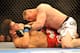 LAS VEGAS - JULY 11: Brock Lesnar holds down Frank Mir during their heavyweight title bout during UFC 100 on July 11, 2009 in Las Vegas, Nevada. (Photo by Jon Kopaloff/Getty Images)