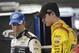 CONCORD, NC - DECEMBER 12: Brad Keselowski (l), driver of the #2 Miller Lite Ford, speaks with teammate Joey Logano, driver of the #22 Shell/Pennzoil Ford, in the garage area during testing at Charlotte Motor Speedway on December 12, 2012 in Concord, North Carolina. (Photo by Jared C. Tilton/Getty Images for NASCAR)