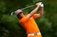 AUGUSTA, GA - APRIL 14: Rickie Fowler of the United States hits a shot on the fourth hole during the final round of the 2013 Masters Tournament at Augusta National Golf Club on April 14, 2013 in Augusta, Georgia. (Photo by Mike Ehrmann/Getty Images)