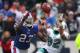 ORCHARD PARK, NY - DECEMBER 18: Brian Hartline #82 of the Miami Dolphins catches a pass during their NFL game as Aaron Williams #23 of the Buffalo Bills defends at Ralph Wilson Stadium on December 18, 2011 in Orchard Park, New York. (Photo by Tom Szczerbowski/Getty Images)