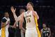 Apr 14, 2013; Los Angeles, CA, USA; Los Angeles Lakers forward Pau Gasol (16) celebrates after making a 3-point basket in the second half as Lakers center Dwight Howard (12) and San Antonio Spurs forward Tim Duncan (21) and guard Gary Neal (14) watch at the Staples Center. The Lakers defeated the Spurs 91-88. Mandatory Credit: Kirby Lee-USA TODAY Sports