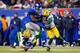 EAST RUTHERFORD, NJ - NOVEMBER 25: Running back Andre Brown #35 of the New York Giants hurts his leg while getting tackled by free safety M.D. Jennings #43 and cornerback Tramon Williams #38 of the Green Bay Packers in the fourth quarterat MetLife Stadium on November 25, 2012 in East Rutherford, New Jersey. (Photo by Rich Schultz/Getty Images)