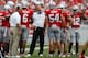COLUMBUS, OH - SEPTEMBER 1: Head Coach Urban Meyer of the Ohio State Buckeyes watches a reply while meeting with members of his defense during a timeout on September 1, 2012 at Ohio Stadium in Columbus, Ohio. Ohio State defeated Miami 56-10. (Photo by Kirk Irwin/Getty Images)