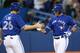 TORONTO, CANADA - APRIL 6: J.P. Arencibia #9 of the Toronto Blue Jays is congratulated by Adam Lind #26 after hitting a 2-run home run in the fourth inning during MLB game action against the Boston Red Sox on April 6, 2013 at Rogers Centre in Toronto, Ontario, Canada. (Photo by Tom Szczerbowski/Getty Images)