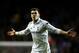 LONDON, ENGLAND - FEBRUARY 14: Gareth Bale of Spurs celebrates after scoring his team's match winning second goal from a free kick during the UEFA Europa League round of 32 first leg match between Tottenham Hotspur and Olympique Lyonnais at White Hart Lane on February 14, 2013 in London, England. (Photo by Paul Gilham/Getty Images)