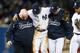 NEW YORK, NY - OCTOBER 13: Derek Jeter #2 of the New York Yankees is carried off of the field by trainer Steve Donohue (L) and manager Joe Girardi after Jeter injured his leg in the top of the 12th inning against the Detroit Tigers during Game One of the American League Championship Series at Yankee Stadium on October 13, 2012 in the Bronx borough of New York City, New York. (Photo by Al Bello/Getty Images)