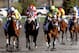 LEXINGTON, KY - APRIL 13: Java's War #4, riden by Julien Leparoux, crosses the finish line ahead of Charming Kitten #8, riden by Joe Bravo and Palace Malice #5, riden by Garrett Gomez to win the 89th Toyota Blue Grass Stakes at Keenland Race Course on April 13, 2013 in Lexington, Kentucky. (Photo by Matthew Stockman/Getty Images)