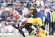 December 23, 2012; Pittsburgh, PA, USA; Cincinnati Bengals wide receiver A.J. Green (18) fumbles the ball as he is hit by Pittsburgh Steelers outside linebacker James Harrison (right) during the fourth quarter at Heinz Field. The Cincinnati Bengals won 13-10. Mandatory Credit: Charles LeClaire-USA TODAY Sports
