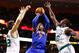 BOSTON, MA - MARCH 26: Carmelo Anthony #7 of the New York Knicks goes up for a shot between two Boston Celtics defenders, Shavlik Randolph #42 and Brandon Bass #30 during the game on March 26, 2013 at TD Garden in Boston, Massachusetts. NOTE TO USER: User expressly acknowledges and agrees that, by downloading and or using this photograph, User is consenting to the terms and conditions of the Getty Images License Agreement. (Photo by Jared Wickerham/Getty Images)