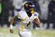 Dec 29, 2012; Bronx, NY, USA; West Virginia Mountaineers wide receiver Tavon Austin (1) runs with the ball during the second quarter against the Syracuse Orange at the 2012 New Era Pinstripe Bowl at Yankee Stadium. Mandatory Credit: Rich Barnes-USA TODAY Sports