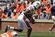 Apr 20, 2013; Auburn, AL, USA; Auburn linebacker Justin Garrett (26) scores a defensive touchdown on a high snap lose ball past Auburn quarterback Jonathan Wallace (12) during their A-Day spring game at Jordan-Hare Stadium. Mandatory Credit: John David Mercer-USA TODAY Sports