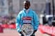 LONDON, ENGLAND - APRIL 21: Tsegaye Kebede of Ethiopia poses with his first prize trophy winning the Virgin London Marathon 2013 on April 21, 2013 in London, England. (Photo by Warren Little/Getty Images)