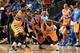 DENVER, CO - APRIL 20: Stephen Curry #30 of the Golden State Warriors turns the ball over to the defensive pressure of Wilson Chandler #21 of the Denver Nuggets and Ty Lawson #3 of the Denver Nuggets during Game One of the Western Conference Quarterfinals of the 2013 NBA Playoffs at the Pepsi Center on April 20, 2013 in Denver, Colorado. The Nuggets defeated the Warriors 97-95. NOTE TO USER: User expressly acknowledges and agrees that, by downloading and or using this photograph, User is consenting to the terms and conditions of the Getty Images License Agreement. (Photo by Doug Pensinger/Getty Images)