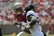 TALLAHASSEE, FL - SEPTEMBER 15: Joshua Harris #25 of the Wake Forest Demon Deacons is pursued by Xavier Rhodes #27 of the Florida State Seminoles during a game at Doak Campbell Stadium on September 15, 2012 in Tallahassee, Florida. (Photo by Stacy Revere/Getty Images)