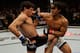 Apr 20, 2013; San Jose, CA, USA; Benson Henderson (right) fights Gilbert Melendez (left) during the lightweight championship bout of the UFC on Fuel TV at HP Pavilion. Mandatory Credit: Kyle Terada-USA TODAY Sports