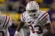 BATON ROUGE, LA - NOVEMBER 12: Jarrett Lee #12 of the Louisiana State University Tigers is chased by Bo Adebayo #90 and Quanterus Smith #93 of the Western Kentucky Hilltoppers at Tiger Stadium on November 12, 2011 in Baton Rouge, Louisiana. The Tigers defeated the Hilltoppers 42-9. (Photo by Chris Graythen/Getty Images)