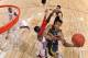 COLUMBUS, OH - JANUARY 13: Trey Burke #3 of the Michigan Wolverines drives to the basket and shoots over Deshaun Thomas #1 of the Ohio State Buckeyes in the first half on January 13, 2013 at Value City Arena in Columbus, Ohio. Ohio State defeated Michigan 56-53. (Photo by Jamie Sabau/Getty Images)