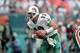 5 Dec 1999: Dan Marino #13 of the Miami Dolphins scrambles with the ball during the game against the Indianapolis Colts at the Pro Player Stadium in Miami, Florida. The Colts defeated the Dolphins 37-34. Mandatory Credit: Andy Lyons /Allsport