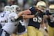 SOUTH BEND, IN - OCTOBER 20: Tony Springman #69 of the Notre Dame Fighting Irish moves around Braden Brown #75 of the BYU Cougars at Notre Dame Stadium on October 20, 2012 in South Bend, Indiana. Notre Dame defeated BYU 17-14. (Photo by Jonathan Daniel/Getty Images)