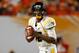 MIAMI GARDENS, FL - JANUARY 04: Geno Smith #12 of the West Virginia Mountaineers looks to pass against the Clemson Tigers during the Discover Orange Bowl at Sun Life Stadium on January 4, 2012 in Miami Gardens, Florida. (Photo by Streeter Lecka/Getty Images)