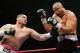 LAS VEGAS - APRIL 11: Chris Arreola (L) hits Jameel McCline in the fourth round of their heavyweight bout at the Mandalay Bay Events Center April 11, 2009 in Las Vegas, Nevada. Arreola won by knockout in the fourth round. (Photo by Ethan Miller/Getty Images)