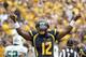 PITTSBURGH, PA - SEPTEMBER 01: Geno Smith #12 of the West Virginia Mountaineers celebrates after a touchdown in the first half against the Marshall Thundering Herd during the game on September 1, 2012 at Mountaineer Field in Morgantown, West Virginia. (Photo by Justin K. Aller/Getty Images)