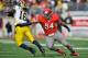 COLUMBUS, OH - NOVEMBER 27: John Simon #54 of the Ohio State Buckeyes attempts to tackle quarterback Denard Robinson #16 of the Michigan Wolverines at Ohio Stadium on November 27, 2010 in Columbus, Ohio. (Photo by Jamie Sabau/Getty Images)