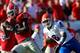 JACKSONVILLE, FL - OCTOBER 30: Jeremy Brown #8 of the Florida Gators attempts to tackle Tavarres King #12 of the Georgia Bulldogs during the game at EverBank Field on October 30, 2010 in Jacksonville, Florida. (Photo by Sam Greenwood/Getty Images)