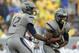 MORGANTOWN, WV - SEPTEMBER 22: Geno Smith #12 of the West Virginia Mountaineers hands the ball off to Tavon Austin #1 against the Maryland Terrapins during the game on September 22, 2012 at Mountaineer Field in Morgantown, West Virginia. WVU defeated Maryland 31-21. (Photo by Justin K. Aller/Getty Images)