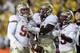 CHESTNUT HILL, MA - NOVEMBER 03: Bjoern Werner #95 of the Florida State Seminoles is congratulated by teammates Vince Williams #11 and Nigel Bradham #13 after Werner intercepted a pass in the second half against the Boston College Eagles on November 3, 2011 at Alumni Stadium in Chestnut Hill, Massachusetts. The Florida State Seminoles defeated the Boston College Eagles 38-7. (Photo by Elsa/Getty Images)