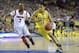 Apr 8, 2013; Atlanta, GA, USA; Michigan Wolverines guard Trey Burke (3) drives against Louisville Cardinals guard Russ Smith (2) during the first half of the championship game in the 2013 NCAA mens Final Four at the Georgia Dome. Mandatory Credit: Robert Deutsch-USA TODAY Sports