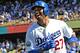 Sept. 30, 2012; Los Angeles, CA, USA; Los Angeles Dodgers center fielder Matt Kemp (27) smiles as he heads to the dugout after a 2-run home run in the fourth inning against the Colorado Rockies at Dodger Stadium. Dodgers won 7-1. Mandatory Credit: Jayne Kamin-Oncea-USA TODAY Sports