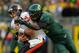 EUGENE, OR - NOVEMBER 26: Dion Jordan #96 of the Oregon Ducks tries to sackes quarterback Sean Mannion #4 of the Oregon State Beavers during the 115th Civil War on November 26, 2011 at the Autzen Stadium in Eugene, Oregon. (Photo by Jonathan Ferrey/Getty Images)
