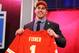 NEW YORK, NY - APRIL 25: Eric Fisher of Central Michigan Chippewas holds up a jersey on stage after he was picked #1 overall by the Kansas City Chiefs in the first round of the 2013 NFL Draft at Radio City Music Hall on April 25, 2013 in New York City. (Photo by Al Bello/Getty Images)