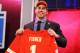 NEW YORK, NY - APRIL 25: Eric Fisher of Central Michigan Chippewas holds up a jersey on stage after he was picked #1 overall by the Kansas City Chiefs in the first round of the 2013 NFL Draft at Radio City Music Hall on April 25, 2013 in New York City. (Photo by Al Bello/Getty Images)