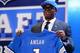 NEW YORK, NY - APRIL 25: Ezekiel Ansah of the BYU Cougars holds up a jersey on stage after he was picked #5 overall by the Detroit Lions in the first round of the 2013 NFL Draft at Radio City Music Hall on April 25, 2013 in New York City. (Photo by Al Bello/Getty Images)