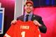 NEW YORK, NY - APRIL 25: Eric Fisher of Central Michigan Chippewas holds up a jersey on stage after he was picked #1 overall by the Kansas City Chiefs in the first round of the 2013 NFL Draft at Radio City Music Hall on April 25, 2013 in New York City. (Photo by Al Bello/Getty Images)