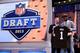 NEW YORK, NY - APRIL 25: Barkevious Mingo of the LSU Tigers stands on stage with NFL Commissioner Roger Goodell as they hold up a jersey on stage after Mingo was picked #6 overall by the Cleveland Browns in the first round of the 2013 NFL Draft at Radio City Music Hall on April 25, 2013 in New York City. (Photo by Al Bello/Getty Images)