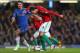 Chelsea's Branislav Ivanovic tries to hold off Swansea City's Michu during the club's Capital One Cup series earlier this year.