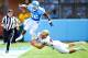 North Carolina's Giovani Bernard leaps to avoid a tackle.