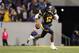 MORGANTOWN, WV - OCTOBER 20: Geno Smith #12 of the West Virginia Mountaineers is flushed out of the pocket against the Kansas State Wildcats during the game on October 20, 2012 at Mountaineer Field in Morgantown, West Virginia. The Wildcats defeated the Mountaineers 55-14. (Photo by Justin K. Aller/Getty Images)