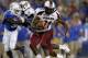 LEXINGTON, KY - SEPTEMBER 29: Marcus Lattimore #21 of the South Carolina Gamecocks breaks free from Mikie Benton #31 of the Kentucky Wildcats during the second half of play at Commonwealth Stadium on September 29, 2012 in Lexington, Kentucky. (Photo by John Sommers II/Getty Images)
