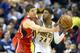 INDIANAPOLIS, IN - APRIL 24: Paul George #24 of the Indiana Pacers looks to pass the ball while defended by Kyle Korver #26 of the Atlanta Hawks during Game Two of the Eastern Conference Quarterfinals of the 2013 NBA Playoffs at Bankers Life Fieldhouse on April 24, 2013 in Indianapolis, Indiana. NOTE TO USER: User expressly acknowledges and agrees that, by downloading and or using this photograph, User is consenting to the terms and conditions of the Getty Images License Agreement. (Photo by Andy Lyons/Getty Images)