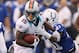 INDIANAPOLIS, IN - NOVEMBER 04: Davone Bess #15 of the Miami Dolphins tries to get around the tackle of Antoine Bethea #41 of the Indianapolis Colts after a first quarter catch at Lucas Oil Stadium on November 4, 2012 in Indianapolis, Indiana. (Photo by Gregory Shamus/Getty Images)